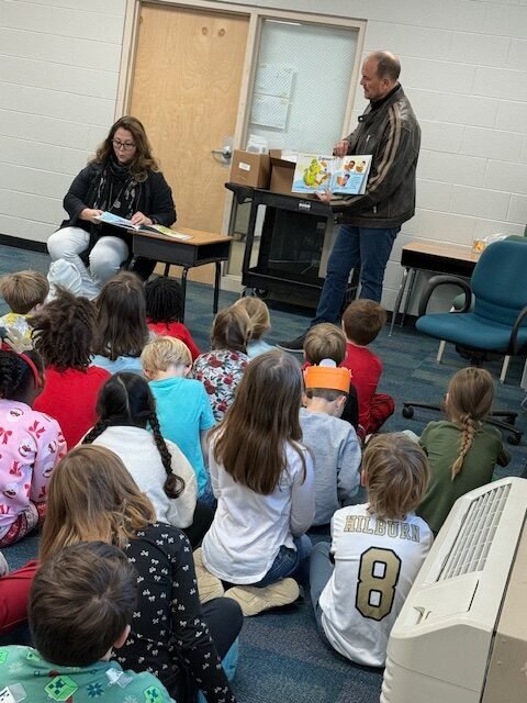 Children enjoying the Fuzzy Dragon story